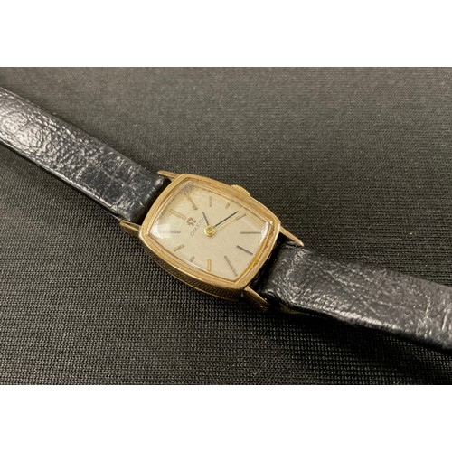 1136 - Omega - a 1960s 9ct gold cased lady's wristwatch, ref 1061, 16mm wide tonneau case, brushed silver d... 