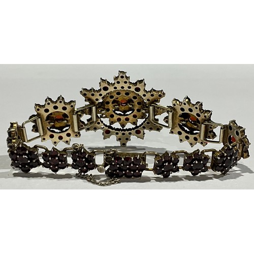 259 - A Bohemian silver gilt garnet cluster bracelet, the central starburst 3cm diameter, the clasp marked... 