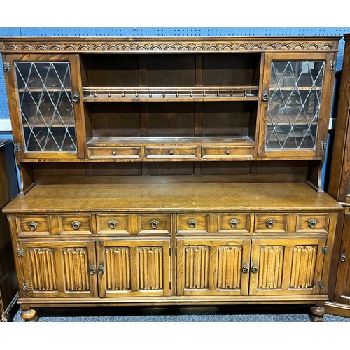 343 - A Younger Toledo sideboard, 76.5cm high, 207cm wide, 48cm deep; an oak dresser; bookcase; floor stan... 