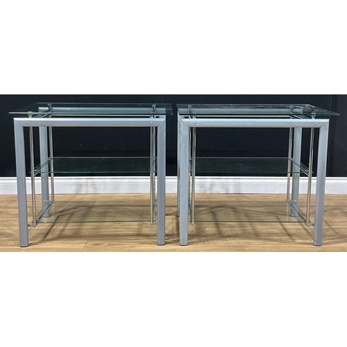 220A - Interior Design - a pair of coated and tubular metal and glass three-tier etageres, 69cm high, 79cm ... 