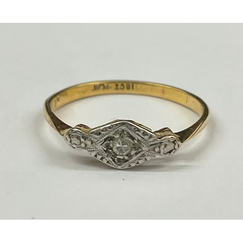 701 - Art Deco 18ct Gold and Platinum Diamond Ring 
The ring is set with a single melee Diamond, hallmarke... 