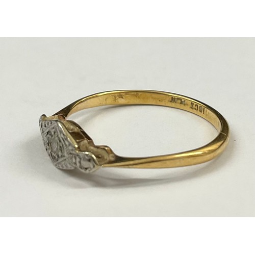 701 - Art Deco 18ct Gold and Platinum Diamond Ring 
The ring is set with a single melee Diamond, hallmarke... 