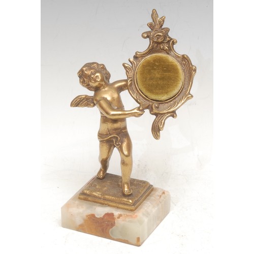 3070 - A Continental gilt metal figural pocket watch stand, cast as a scantily clad putto, onyx base, 20cm ... 