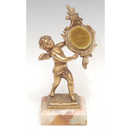 3070 - A Continental gilt metal figural pocket watch stand, cast as a scantily clad putto, onyx base, 20cm ... 