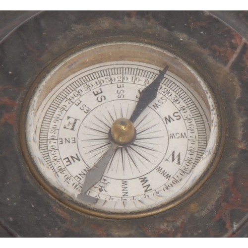 3076 - A Derbyshire fossil stone turned circular compass desk weight, 9cm diam, 19th century