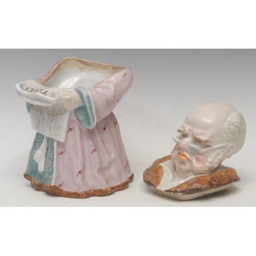 3096 - A German porcelain novelty tobacco jar and cover, as an English gentleman reading the Times newspape... 