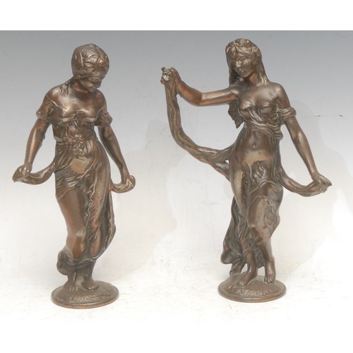 3565 - An Art Nouveau figural bronze, as a scantily dressed maiden, 23cm high; another similar (2)