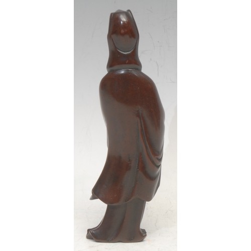 3052 - A Chinese boxwood carving, of Guanyin, she stands, serene, 17cm high