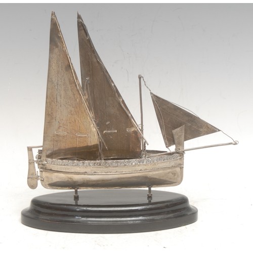 3669 - An early 20th century Maltese 925 silver model, of a sailing boat or luzzu, mounted for display, 20c... 