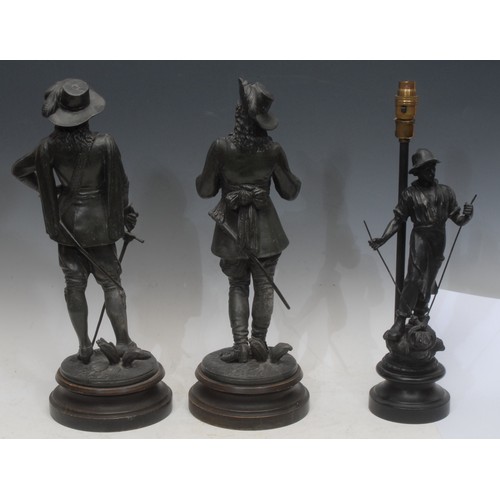 3557 - A patinated bronze effect figural sculpture, of a musketeer with a sword, circular base, 48cm high o... 