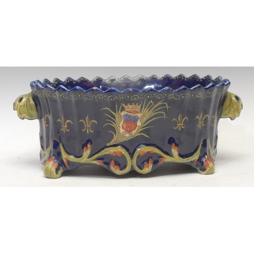 3599 - A 19th century French faience jardinière, the sides hand-painted with a portrait bust of Joan of Arc... 