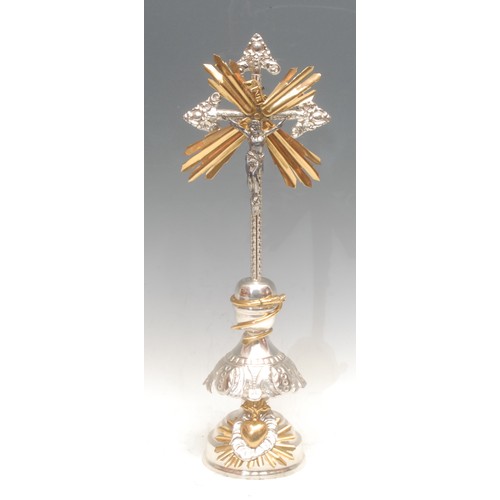 3086 - A French silver plated and gilt metal corpus Christi, mounted for display on a pedestal base coiled ... 