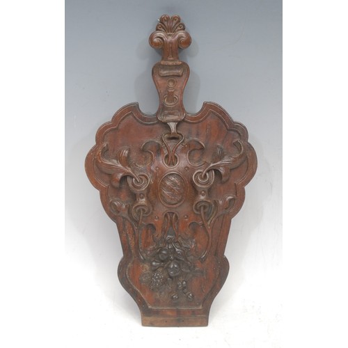 3085 - A French oak panel, carved in relief with an ordinary among scrolling and fruiting vine, 30cm high o... 