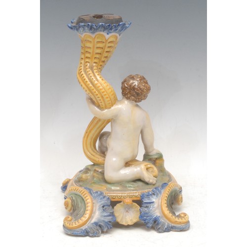 3007 - A 19th century Maiolica flower display, as a putto holding a cornucopia, the base moulded with shell... 