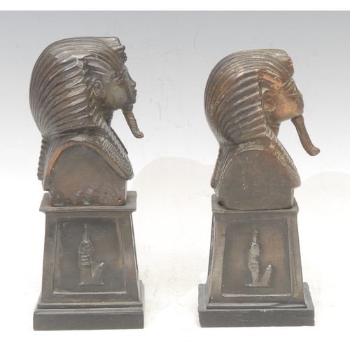 3566 - An associated pair of Egyptian cabinet bronze busts, cast after the mask of Tutankhamun, pedestal ba... 
