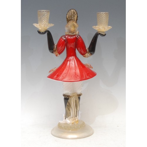 3623 - A Venetian Murano glass figurative candelabra, the column as a Blackamoor holding a pair of twist tu... 