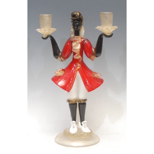 3623 - A Venetian Murano glass figurative candelabra, the column as a Blackamoor holding a pair of twist tu... 