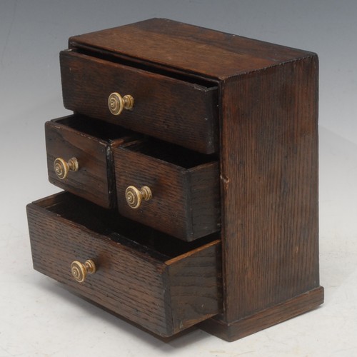 3012 - A 19th century oak collector's chest, of small proportions, one long drawer above two short drawers ... 