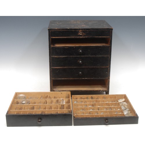 3723 - Horological Spares - a miniature table or workbench top black painted pine graduated six drawer ches... 