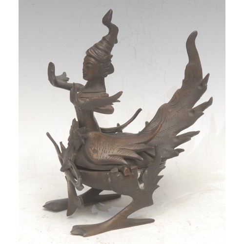 3560 - A Thai bronze figurine, cast as the Buddhist goddess Kinnara, she stands typically as half woman, ha... 