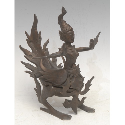 3560 - A Thai bronze figurine, cast as the Buddhist goddess Kinnara, she stands typically as half woman, ha... 
