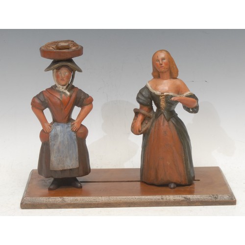 3618 - Folk Art - a pair of 19th century Italian softwood figurines, carved as peasant women, painted in po... 