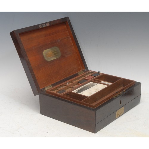 3092 - A George IV rosewood and satinwood cross-banded painter's box, the hinged cover brass mounted and in... 