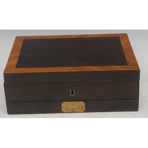 3092 - A George IV rosewood and satinwood cross-banded painter's box, the hinged cover brass mounted and in... 