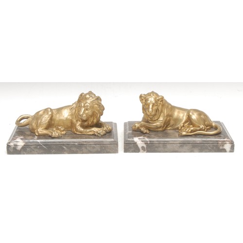 3575 - Italian School (early 20th century), a pair of figural gilt bronzes, Lion and Lioness, after the Lio... 