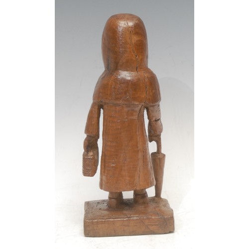 3619 - Folk Art & Treen - a 19th century softwood carving, of an old maid carrying an umbrella and bread ba... 