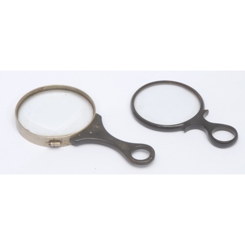3542 - A 19th century horn and white metal magnifying glass, loop handle, 12.5cm long overall; another simi... 