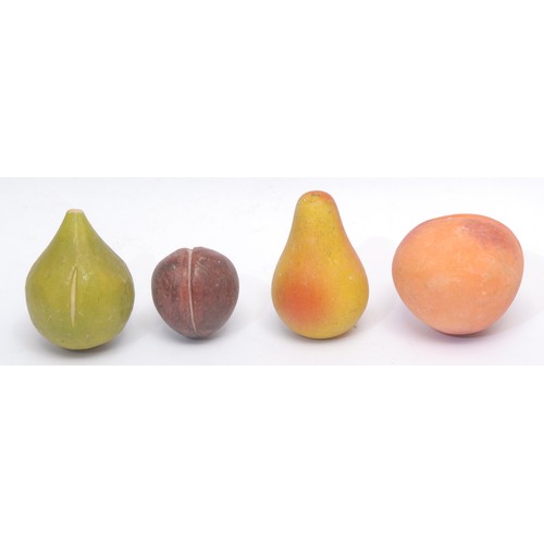 3065 - A collection of alabaster table decorations, naturalistically carved and painted as ripe fruit, the ... 