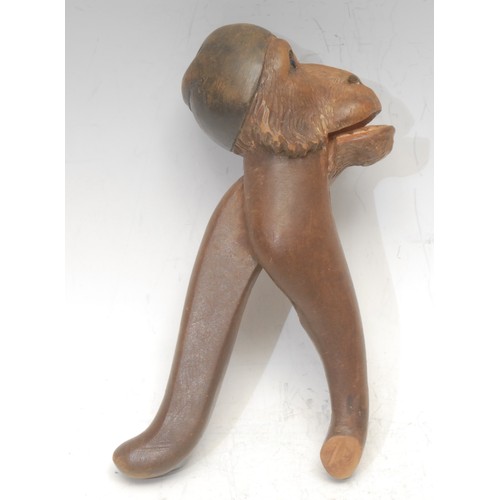 3039 - A Black Forest novelty lever-action nut cracker, carved as the head of a monkey, 18cm long, c.1900; ... 