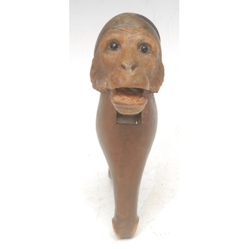 3039 - A Black Forest novelty lever-action nut cracker, carved as the head of a monkey, 18cm long, c.1900; ... 