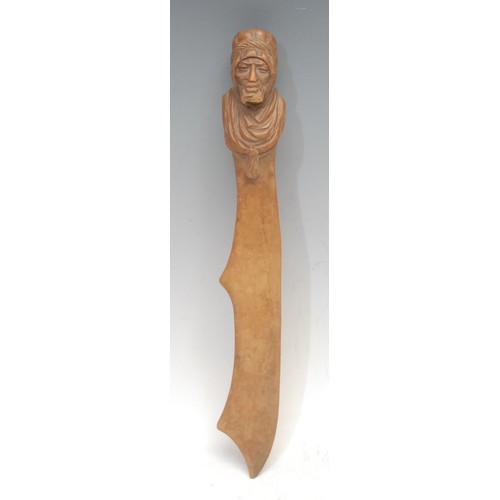 3039 - A Black Forest novelty lever-action nut cracker, carved as the head of a monkey, 18cm long, c.1900; ... 