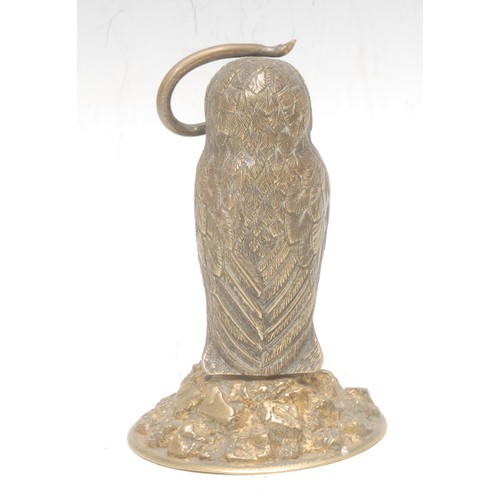 3536 - A 19th century gilt brass novelty pocket watch stand, as an owl, perched on a rocky outcrop, a snake... 