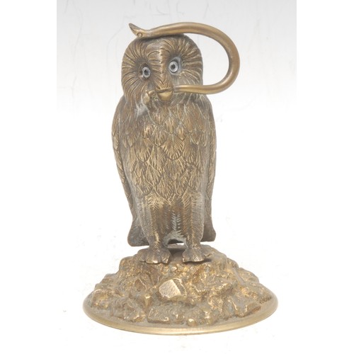 3536 - A 19th century gilt brass novelty pocket watch stand, as an owl, perched on a rocky outcrop, a snake... 