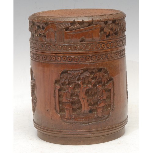 3051 - A Chinese bamboo cylindrical box and cover, carved in relief in the Cantonese taste with panels of f... 