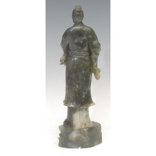 3056 - A Chinese hardstone figure, carved as an immortal, 30cm high