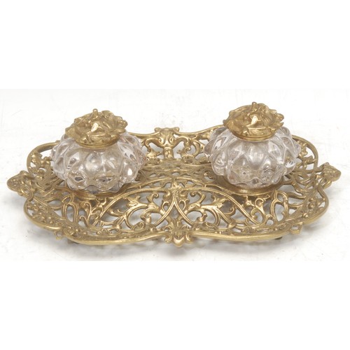 3539 - A 19th century gilt metal inkstand, cast throughout in the Rococo taste with scrolls and diaper pane... 