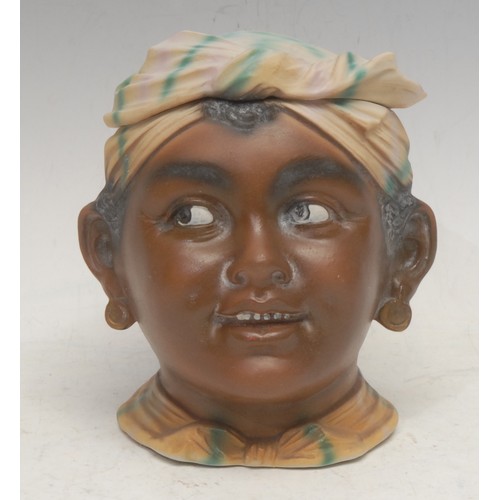 3093 - A German bisque porcelain novelty tobacco jar, as the head of a young Moorish girl, 14.5cm high, c.1... 