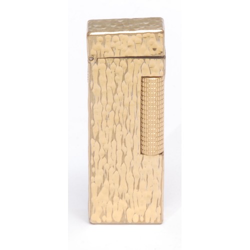 3077 - A Dunhill Rollagas cigarette lighter, gold plated bark-textured case, 6.5cm long