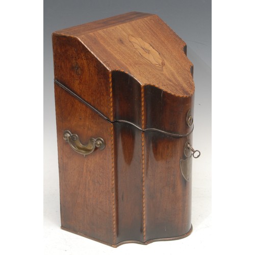 3089 - A George III mahogany serpentine knife box, the hinged cover inlaid with a shell patera, brass combi... 