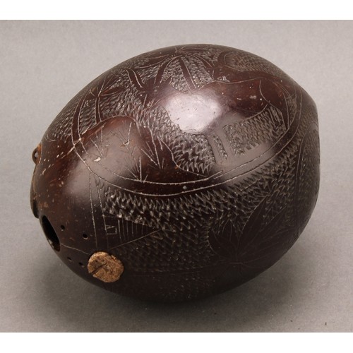 3021A - A 19th century sailor’s bugbear coconut flask, carved with a Naval anchor, flora, fauna and initials... 