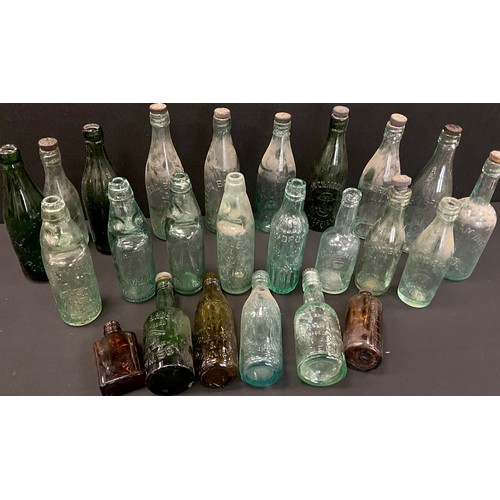 79 - A collection of 19th and 20th century glass codd and other collectible bottles, including;  Whittake... 