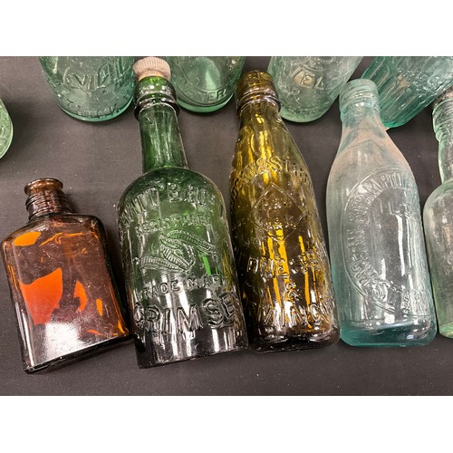 79 - A collection of 19th and 20th century glass codd and other collectible bottles, including;  Whittake... 