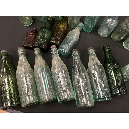 79 - A collection of 19th and 20th century glass codd and other collectible bottles, including;  Whittake... 