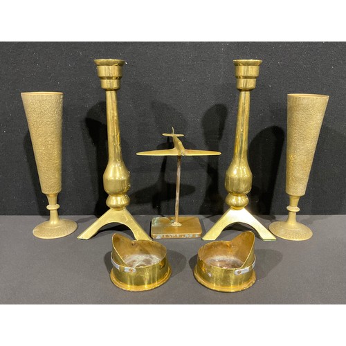 141 - A pair of Brass rocket form candlesticks, tripod base, 30.5cm high, Trench Art shell case Cap shaped... 