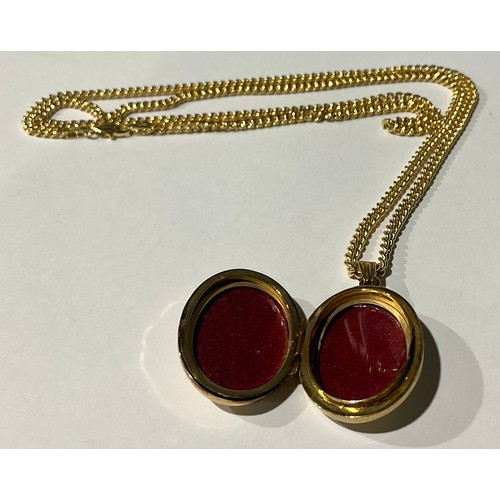 310 - 9ct Gold Oval Locket with 9ct Gold Chain;
the plain locket stamped 