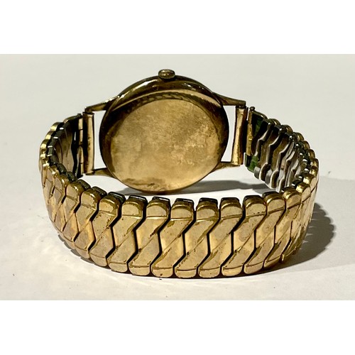 318 - A Gentleman's Accurist 21 Jewels Shockmaster 9ct Gold wristwatch with gold plated stretchable bracel... 